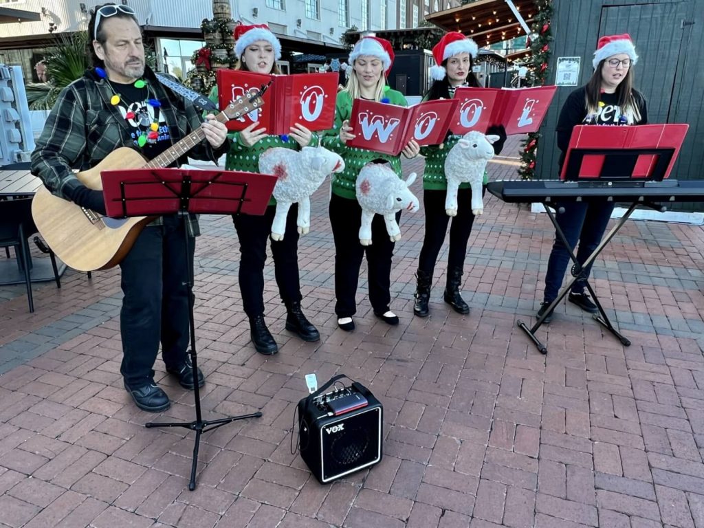 Sleigh What?! Carolers in Shockingly ‘Ugly’ Christmas Sweaters to Sing for a Wool-Free Winter