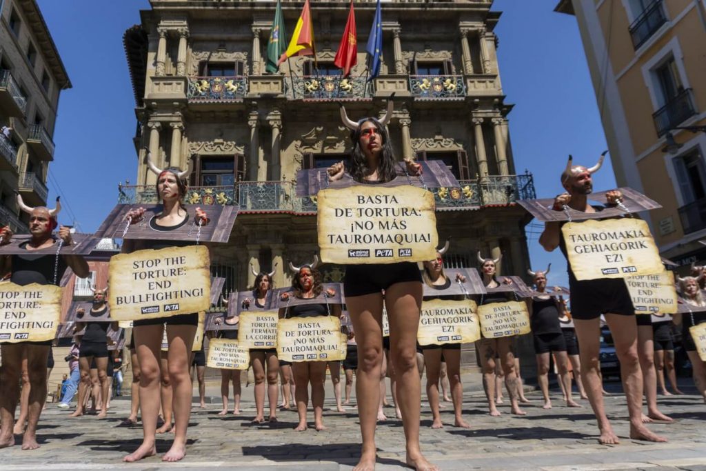 Dozens in Medieval Torture Devices Protest Against Pamplona’s Bullfights